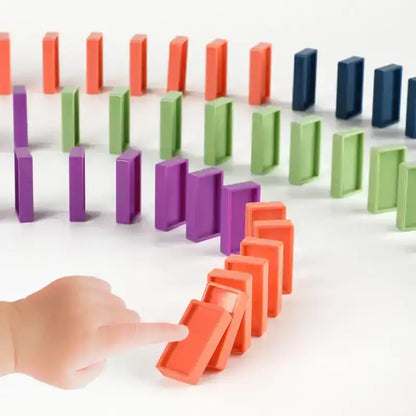 Automatic domino train toy that builds domino lines for children