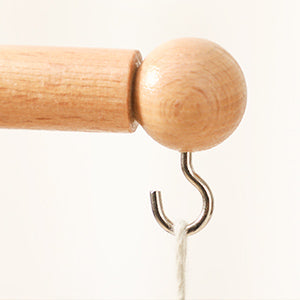 Close up detail of wooden crib mobile holder
