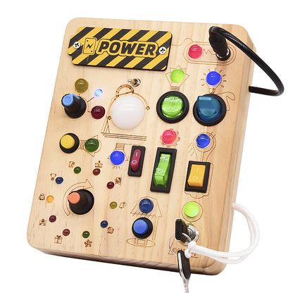 Busy board helping toddlers understand cause and effect through play