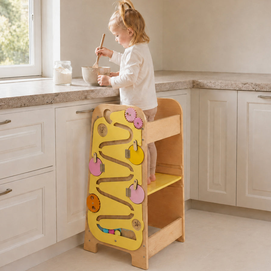 5-in-1 Montessori learning tower helping toddlers participate in kitchen activities