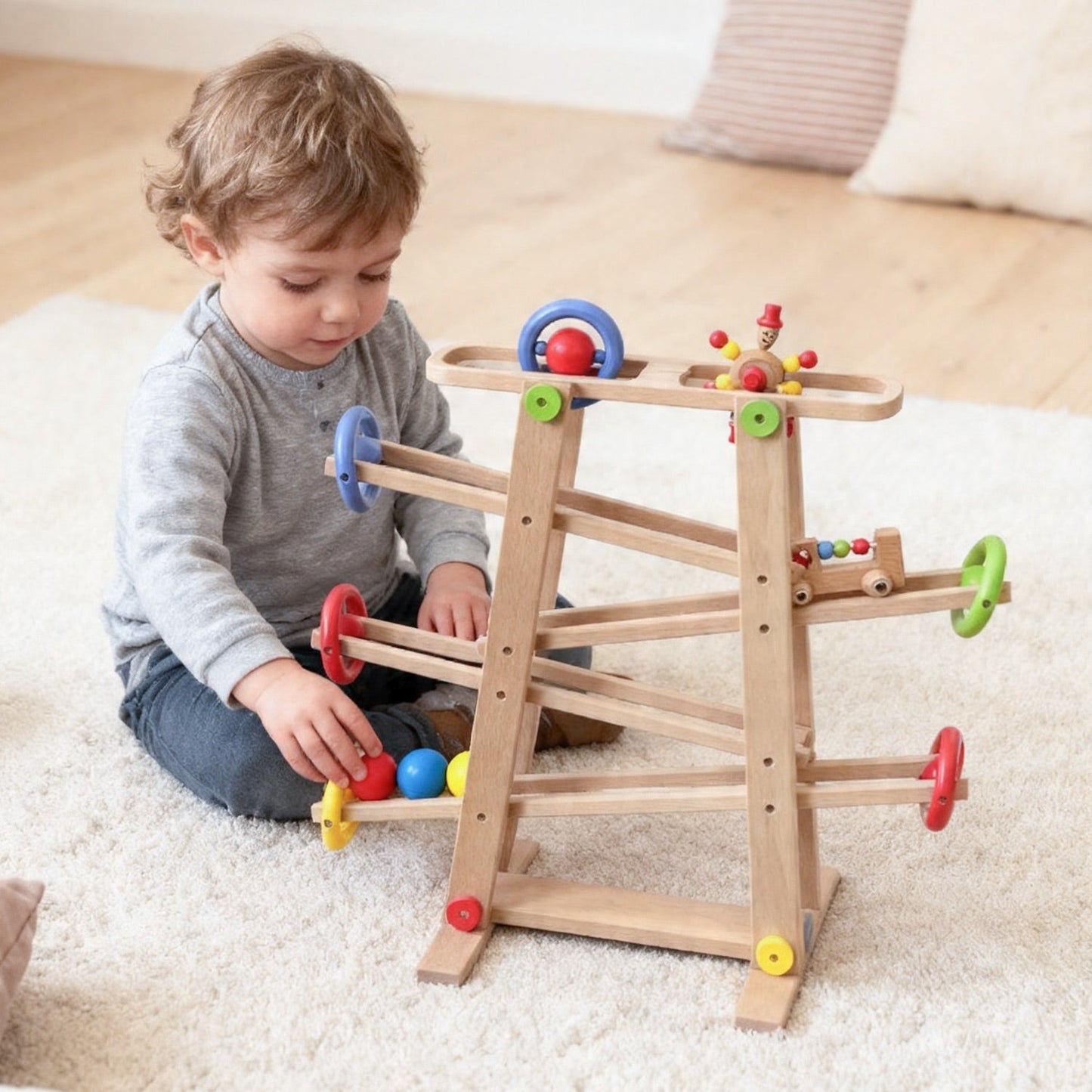 Wooden marble track toy supporting cause and effect learning
